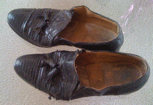 photo of well-worn alligator loafers